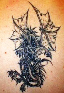 Fantasy dragon tattoo on lowerback
